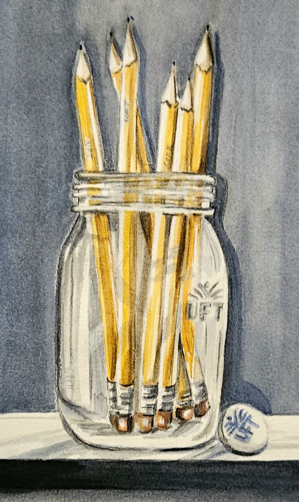Artist pencils and paintbrushes on warm paper